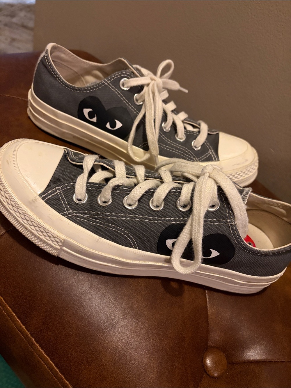 Converse gray low top sneakers with heart-eye graphic